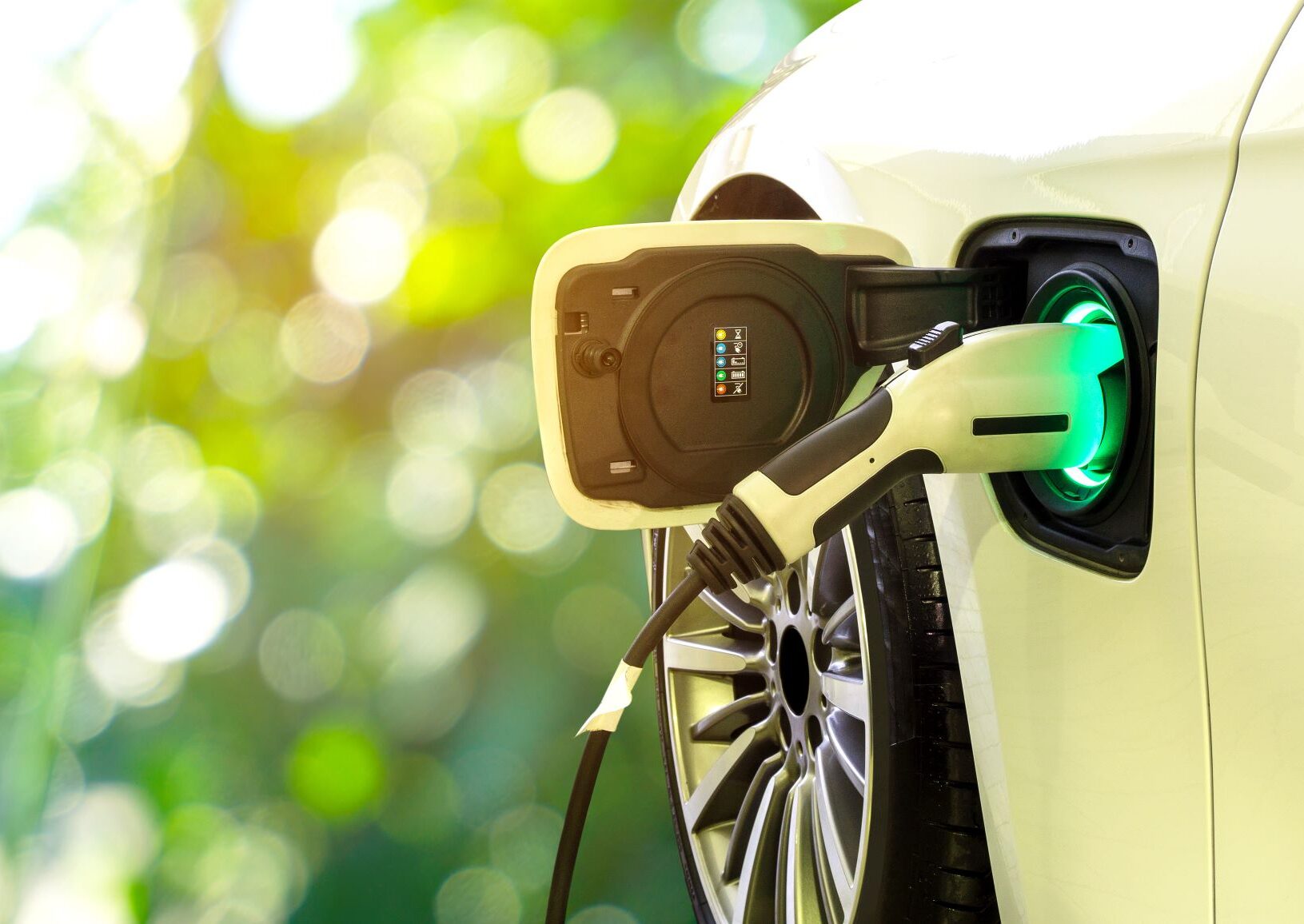 green electric car charging medium e1696005368871
