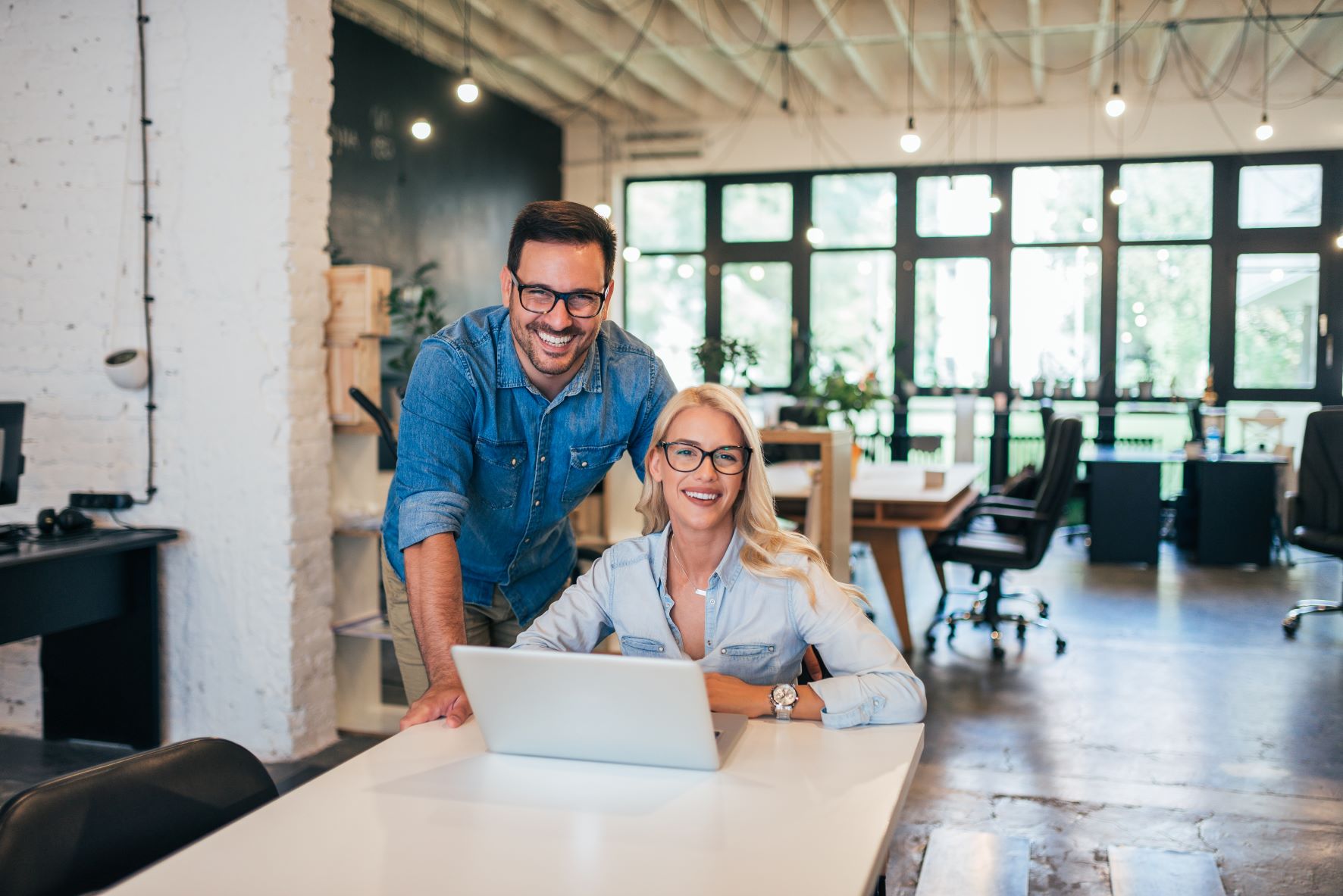 male female desk laptop smiling resized