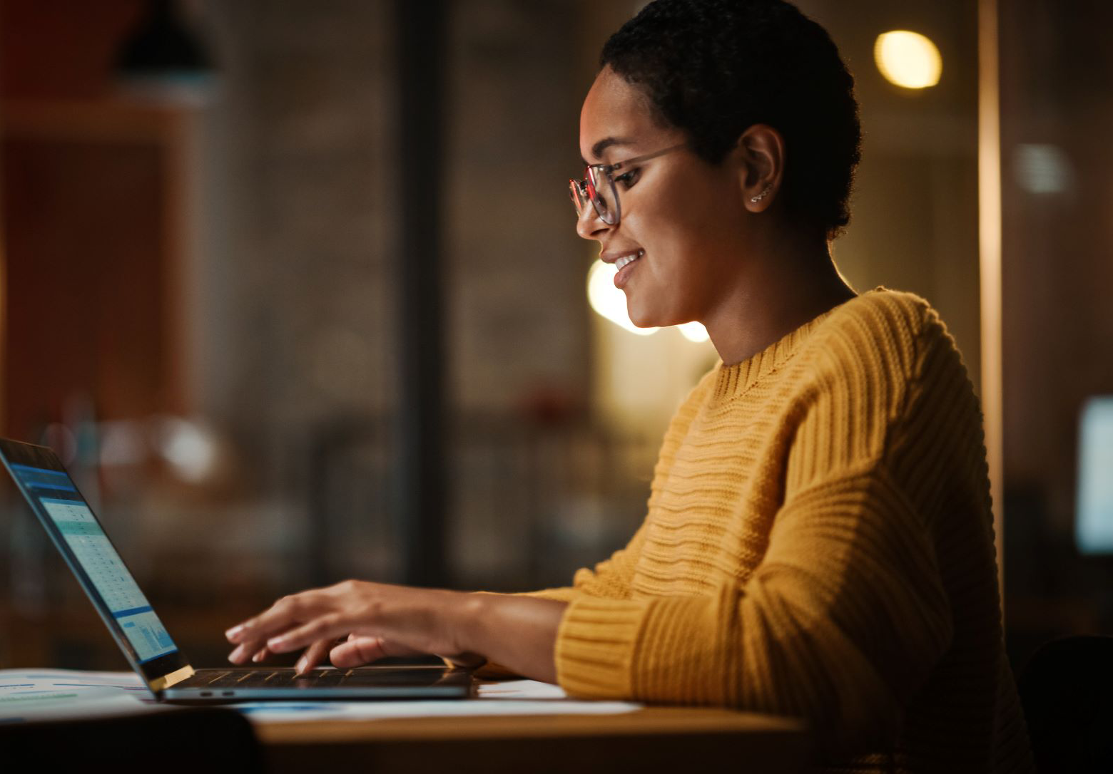 woman sitting desk laptop medium 1