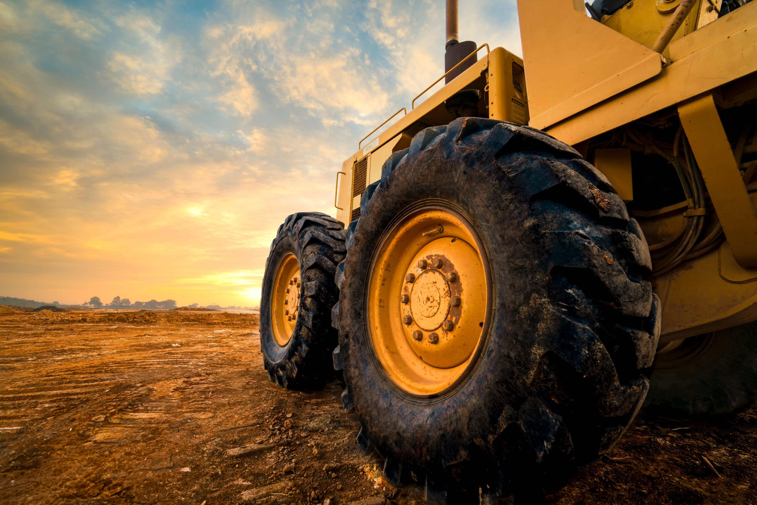 Big,Rubber,Wheels,Of,Soil,Grade,Tractor,Car,Earthmoving,At